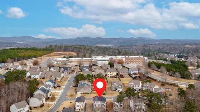 drone / aerial view featuring a mountain view