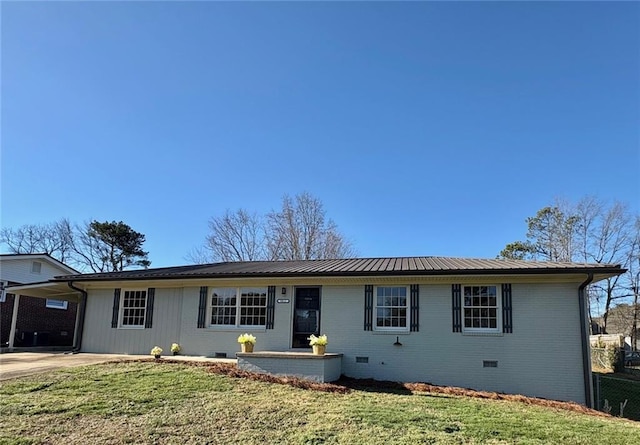 ranch-style home with a front lawn