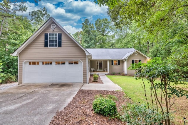 view of front of property featuring a garage and a front lawn