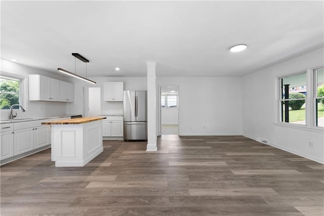 15 Baker St, Cartersville, GA 30120 - kitchen featuring freestanding refrigerator, butcher block countertops, plenty of natural light, white cabinetry, and recessed lighting