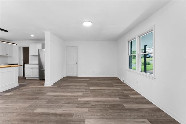 15 Baker St, Cartersville, GA 30120 - unfurnished living room featuring recessed lighting and dark wood finished floors