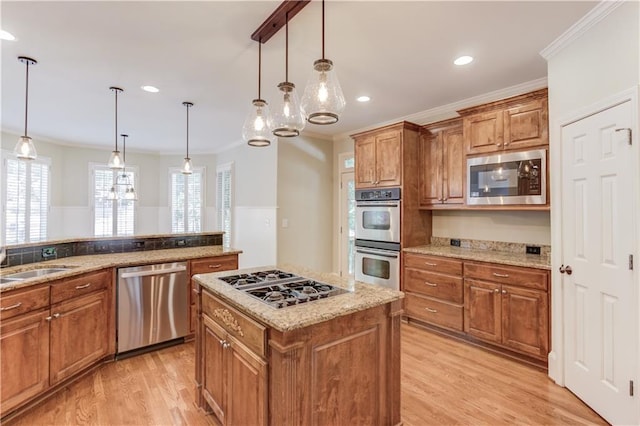 2748 Hidden Falls Dr, Buford, GA 30519 - kitchen with appliances with stainless steel finishes, brown cabinets, crown molding, light wood-style flooring, and recessed lighting