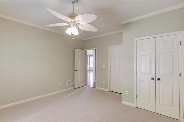 2748 Hidden Falls Dr, Buford, GA 30519 - unfurnished bedroom featuring carpet, ornamental molding, a closet, and a ceiling fan