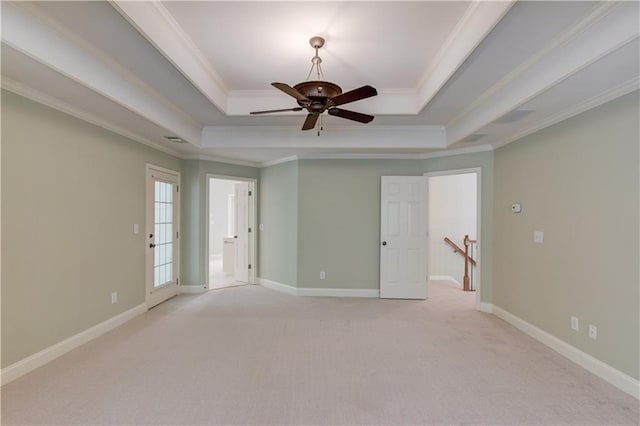 2748 Hidden Falls Dr, Buford, GA 30519 - spare room with a tray ceiling, light carpet, a ceiling fan, and crown molding