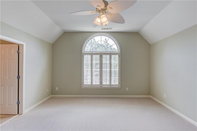 2748 Hidden Falls Dr, Buford, GA 30519 - spare room featuring lofted ceiling, light carpet, and a ceiling fan