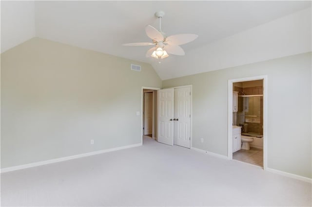 2748 Hidden Falls Dr, Buford, GA 30519 - unfurnished bedroom with vaulted ceiling, light carpet, ensuite bath, a closet, and ceiling fan
