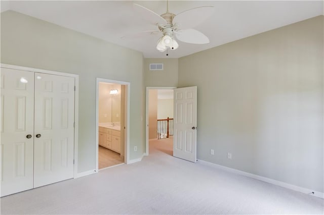 2748 Hidden Falls Dr, Buford, GA 30519 - unfurnished bedroom featuring light colored carpet, a closet, ceiling fan, and ensuite bathroom