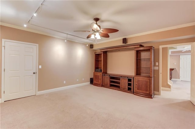 2748 Hidden Falls Dr, Buford, GA 30519 - unfurnished living room with rail lighting, ceiling fan, carpet floors, and crown molding