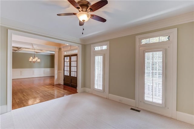 2748 Hidden Falls Dr, Buford, GA 30519 - carpeted empty room with a chandelier, crown molding, a ceiling fan, wood finished floors, and wainscoting