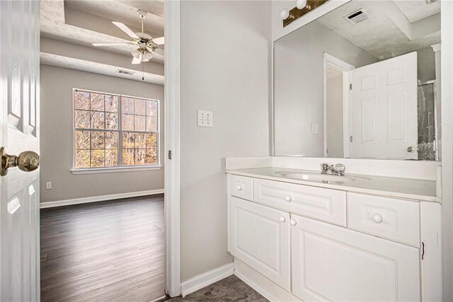 bathroom featuring ceiling fan and vanity