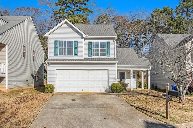 front of property with a garage