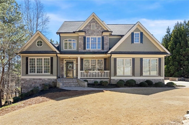 craftsman house with stone siding and a porch