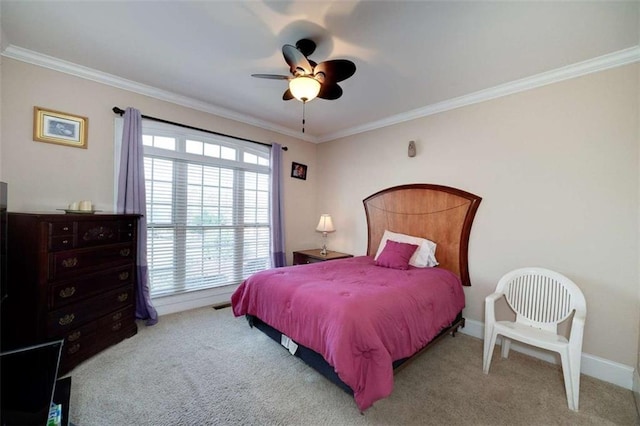 carpeted bedroom featuring crown molding and ceiling fan