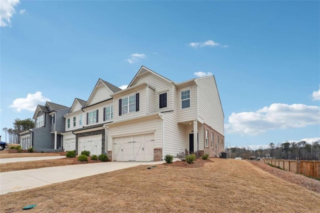 view of front facade featuring driveway, a garage, fence, central air condition unit, and brick siding