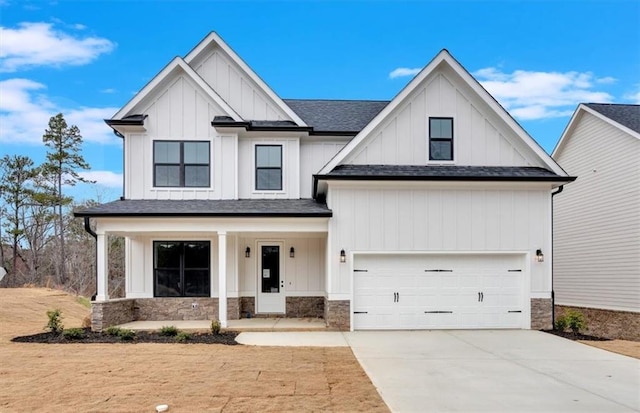 28 Creekview Dr SE, Cartersville, GA 30120 - modern farmhouse with covered porch, driveway, board and batten siding, a garage, and stone siding