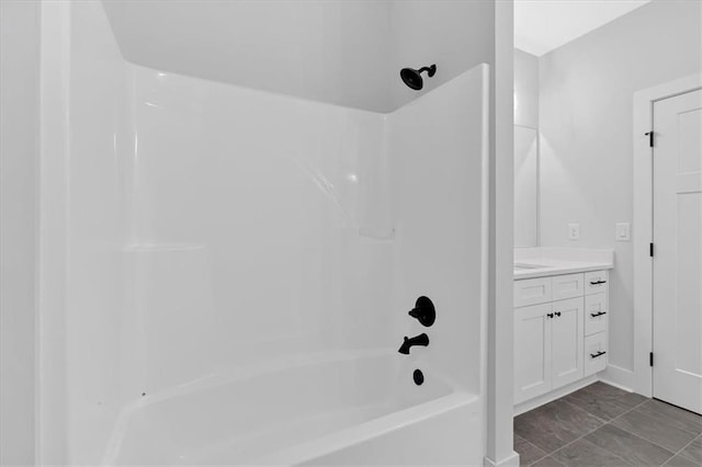 28 Creekview Dr SE, Cartersville, GA 30120 - bathroom featuring bathing tub / shower combination, vanity, marble look tiles, and baseboards