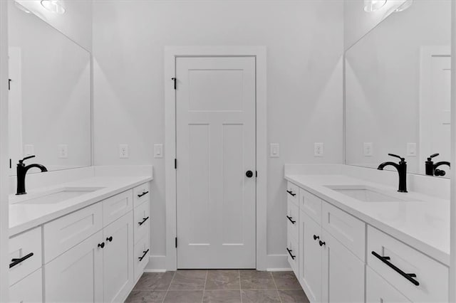 28 Creekview Dr SE, Cartersville, GA 30120 - full bath with two vanities, baseboards, and marble finish floors