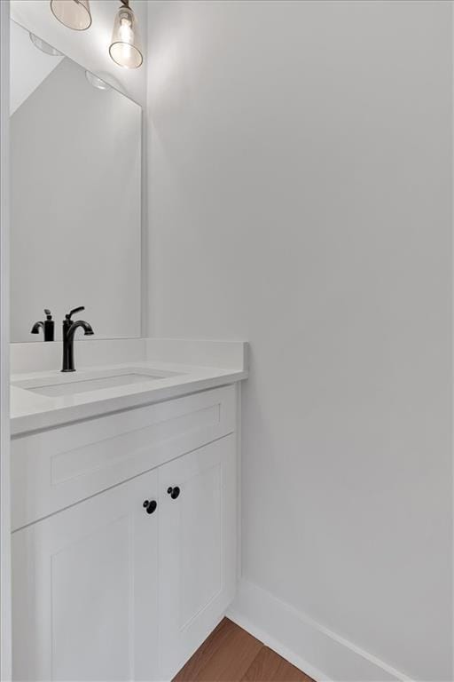 28 Creekview Dr SE, Cartersville, GA 30120 - bathroom with vanity, wood finished floors, and baseboards