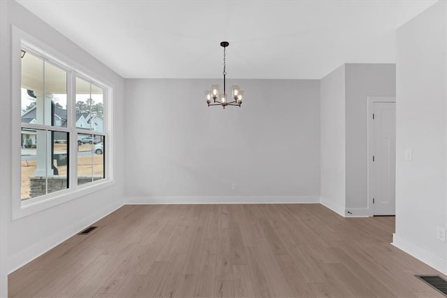 28 Creekview Dr SE, Cartersville, GA 30120 - unfurnished room featuring a chandelier, light wood-style floors, and baseboards