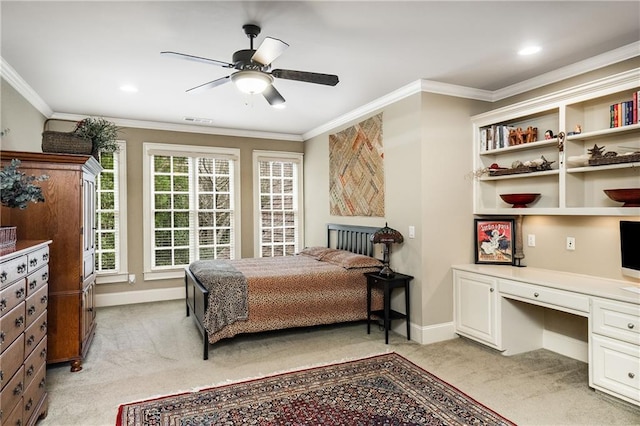 bedroom with ornamental molding, visible vents, light carpet, and built in desk