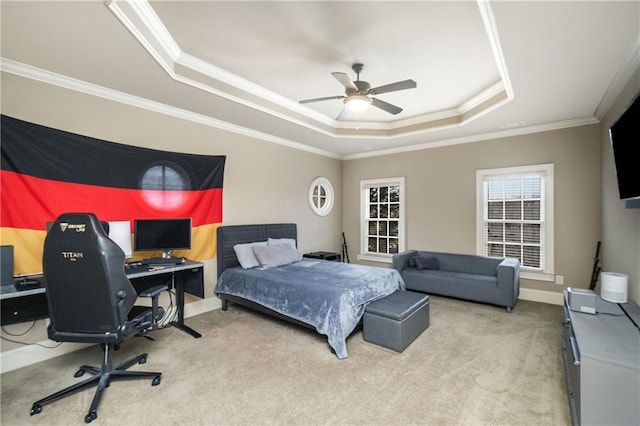 bedroom featuring ornamental molding, carpet, a raised ceiling, and baseboards