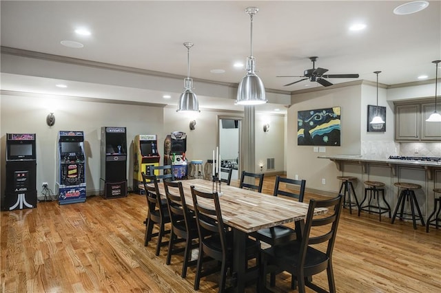 dining space featuring visible vents, ceiling fan, ornamental molding, light wood-style floors, and recessed lighting