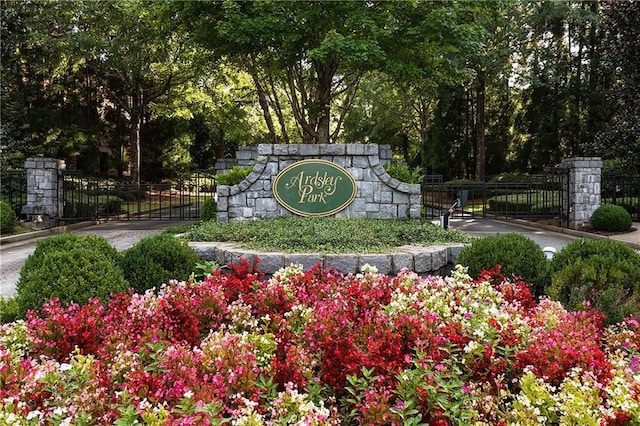 community sign featuring fence