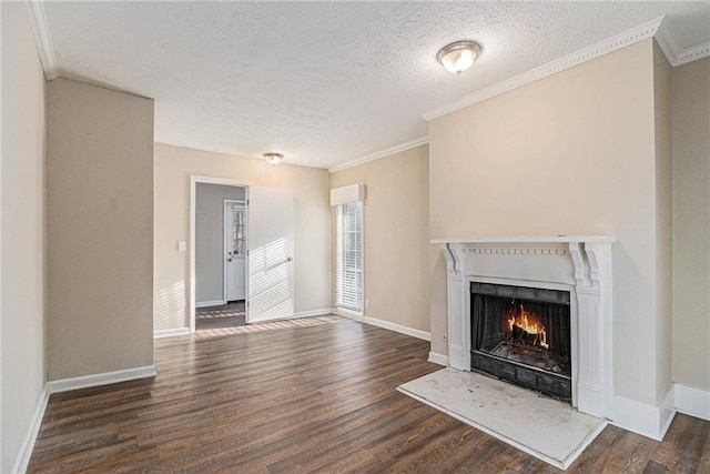 unfurnished living room with crown molding, dark hardwood / wood-style flooring, and a textured ceiling