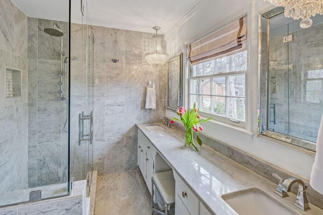 bathroom featuring walk in shower, vanity, tile walls, and a notable chandelier