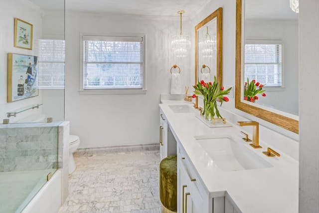 full bathroom with ornamental molding, vanity, toilet, and combined bath / shower with glass door