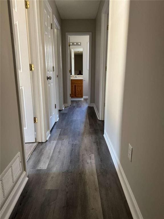 hall with dark hardwood / wood-style floors