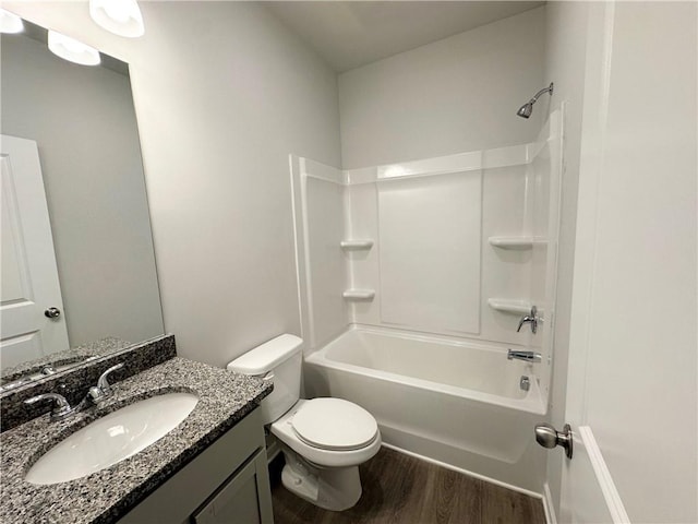 full bathroom with shower / bathtub combination, toilet, wood finished floors, and vanity