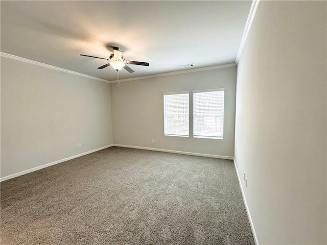 empty room featuring a ceiling fan, baseboards, visible vents, crown molding, and carpet flooring