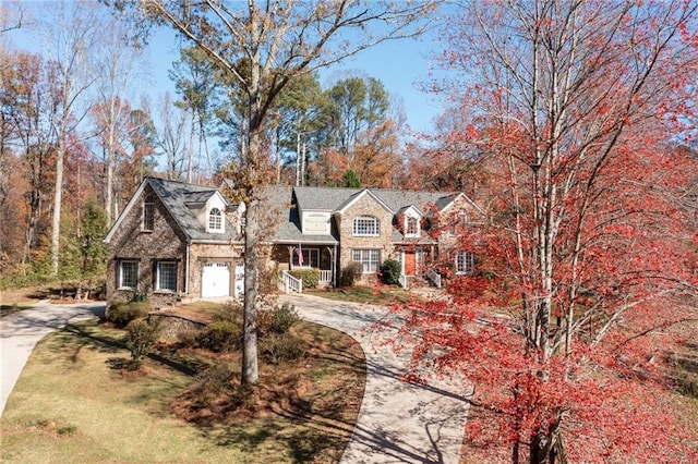 view of front of home with a garage and driveway