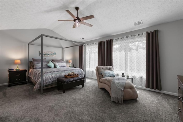 carpeted bedroom with visible vents, a ceiling fan, vaulted ceiling, a textured ceiling, and baseboards