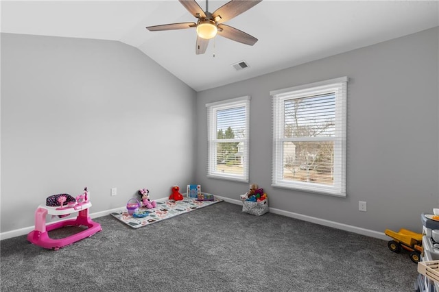 game room featuring carpet floors, visible vents, vaulted ceiling, ceiling fan, and baseboards