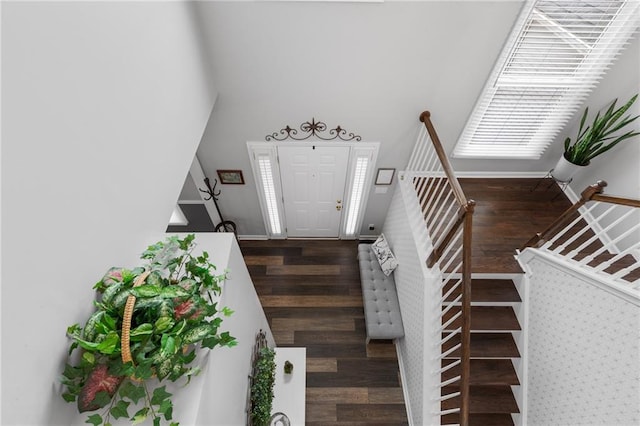 entrance foyer featuring stairway, wood finished floors, and baseboards