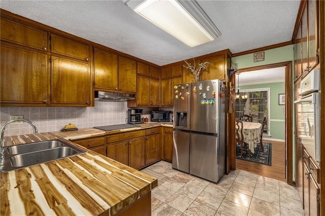 1519 Brookcliff Cir, Marietta, GA 30062 - kitchen featuring crown molding, brown cabinets, a sink, black appliances, and under cabinet range hood