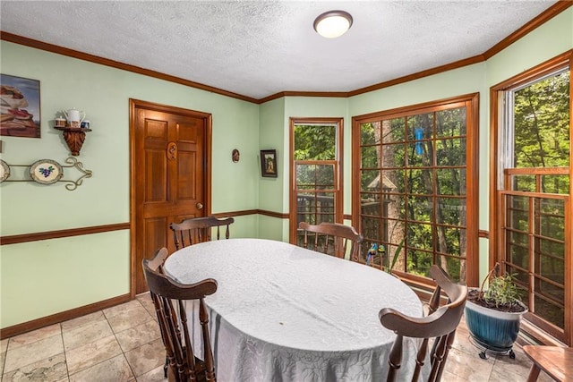 1519 Brookcliff Cir, Marietta, GA 30062 - dining space with baseboards, ornamental molding, a textured ceiling, and light tile patterned floors