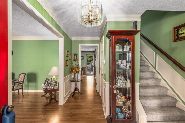 1519 Brookcliff Cir, Marietta, GA 30062 - foyer featuring an inviting chandelier, a textured ceiling, wood finished floors, and stairway
