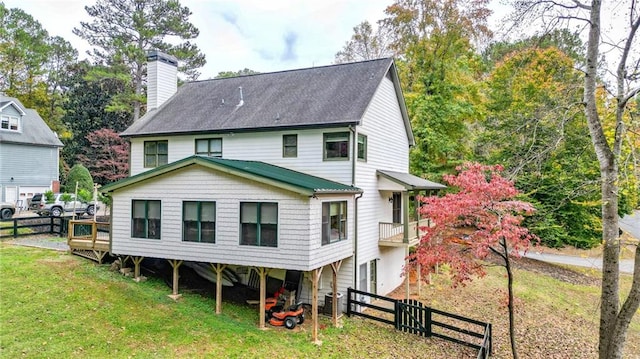 back of house with a yard