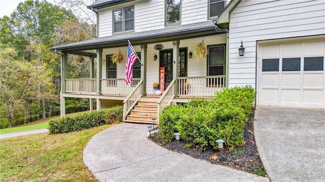 view of front facade featuring a porch and a garage