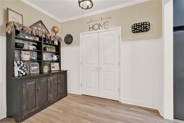 interior space featuring light hardwood / wood-style flooring and crown molding