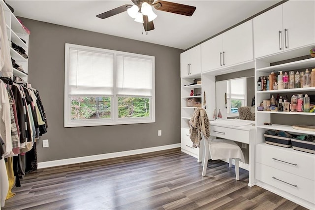 office with dark hardwood / wood-style floors and ceiling fan