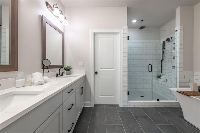 bathroom featuring vanity, independent shower and bath, and tile patterned flooring