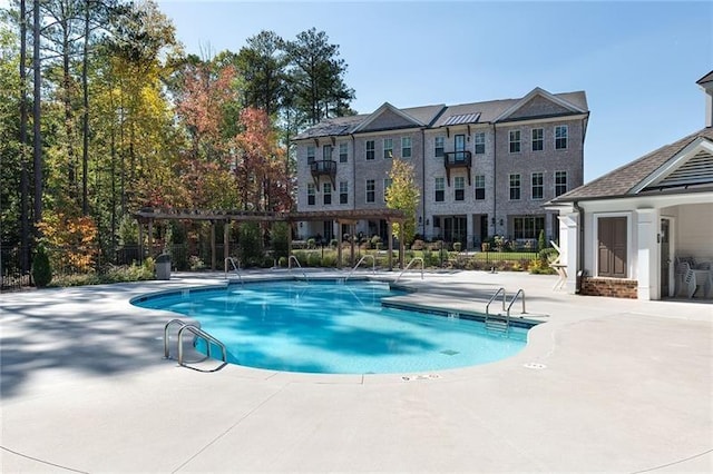 view of swimming pool featuring a patio