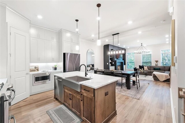 living room featuring hardwood / wood-style flooring and ornamental molding