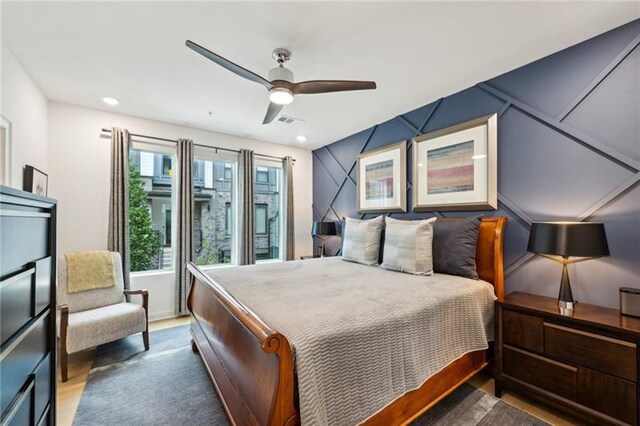 living room with ceiling fan, sink, and light hardwood / wood-style flooring