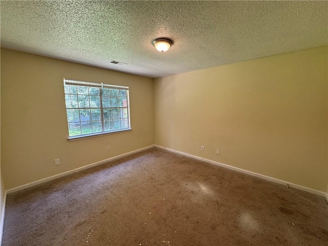 1050 Redan Trce, Stone Mountain, GA 30088 - carpeted spare room with baseboards and a textured ceiling