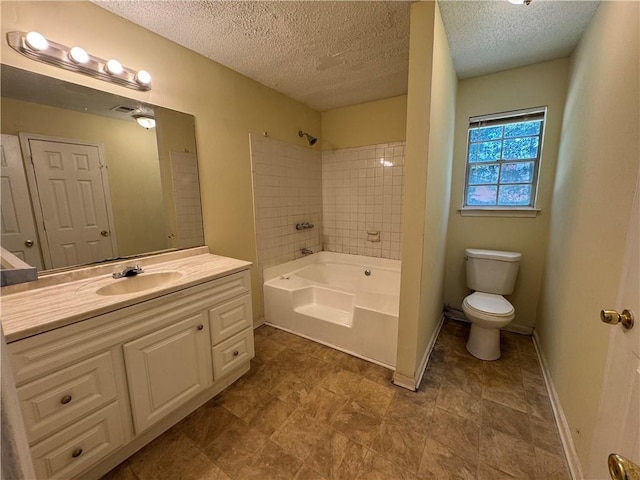 1050 Redan Trce, Stone Mountain, GA 30088 - bathroom with toilet, a textured ceiling, vanity, baseboards, and shower / washtub combination
